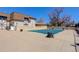 Outdoor community swimming pool covered for the off season near a brick building with a brown roof at 7201 E Quincy Ave # 103, Denver, CO 80237