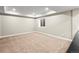 Spacious carpeted basement area with recessed lighting and a window offers versatile living space at 7899 E 28Th Pl, Denver, CO 80238