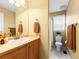 Bright bathroom includes a lovely vanity and tiled floors at 7899 E 28Th Pl, Denver, CO 80238