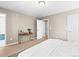 Spacious bedroom with cozy decor, carpeted floors, and a large bed at 7899 E 28Th Pl, Denver, CO 80238