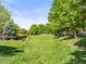Lush green space with mature trees and manicured lawns offers a tranquil outdoor setting at 7899 E 28Th Pl, Denver, CO 80238
