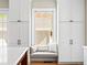 Eat-in kitchen nook with custom cabinetry and window seat at 7899 E 28Th Pl, Denver, CO 80238