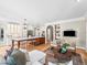 Open-concept living room and kitchen with a seamless flow, creating an inviting and social atmosphere at 7899 E 28Th Pl, Denver, CO 80238