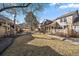 Well-manicured townhouse exterior with walkways and communal green spaces at 3310 W 98Th Ave # B, Westminster, CO 80031