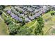 Expansive aerial shot showcasing a residential neighborhood with tree-lined streets, manicured lawns, and well-maintained homes at 1873 Trevor Cir, Longmont, CO 80501