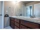 Bathroom features double sinks, a spacious vanity with generous countertop space, and modern fixtures at 1873 Trevor Cir, Longmont, CO 80501