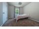 Cozy bedroom with plush carpeting, a bright window, and minimalist decor at 1873 Trevor Cir, Longmont, CO 80501