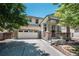 Charming two-story home with stone accents, a covered porch, and a two-car garage at 1873 Trevor Cir, Longmont, CO 80501