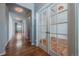 Spacious hallway with hardwood floors leading to various rooms in the home at 1873 Trevor Cir, Longmont, CO 80501
