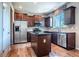 Stylish kitchen with stainless steel appliances and dark wood cabinets at 1873 Trevor Cir, Longmont, CO 80501