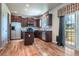 Modern kitchen with granite countertops, stainless steel appliances, and wood cabinetry at 1873 Trevor Cir, Longmont, CO 80501