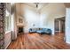 Bright living room with hardwood floors, high ceilings, and a cozy fireplace at 1873 Trevor Cir, Longmont, CO 80501
