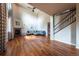 Sunlit living room with hardwood floors, fireplace, and a comfortable sectional couch at 1873 Trevor Cir, Longmont, CO 80501