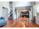 Bright, open living space with hardwood floors that connect the living room and kitchen at 1873 Trevor Cir, Longmont, CO 80501