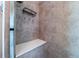 Tiled shower with built-in bench and convenient storage niche, offering a spa-like experience at 1873 Trevor Cir, Longmont, CO 80501