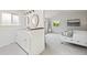 Bright main bathroom with dual sinks, modern mirrors, and stylish flooring at 8035 S Garfield Way, Centennial, CO 80122