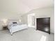 Bright main bedroom with light walls, vaulted ceiling, and large dresser at 8035 S Garfield Way, Centennial, CO 80122