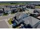 A scenic aerial view showcases a modern community, and tree-lined streets at 11246 Bellsong Ln, Littleton, CO 80125