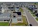 An aerial perspective of a planned neighborhood with energy-efficient homes and green spaces at 11246 Bellsong Ln, Littleton, CO 80125