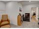 This finished basement is carpeted and includes a sitting area with a bookcase at 11246 Bellsong Ln, Littleton, CO 80125