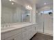 Elegant bathroom with dual vanities, quartz countertops, and a luxurious shower at 11246 Bellsong Ln, Littleton, CO 80125