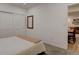 Bright bedroom showcasing a closet, mirror, and an adjacent dining area at 11246 Bellsong Ln, Littleton, CO 80125