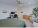 Well-lit bedroom with a neutral color scheme and a dedicated workspace at 11246 Bellsong Ln, Littleton, CO 80125