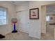 Cozy bedroom featuring neutral carpet, natural light from a window, and closet storage at 11246 Bellsong Ln, Littleton, CO 80125