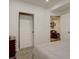 The bedroom has neutral colored walls and carpet with a door to another room at 11246 Bellsong Ln, Littleton, CO 80125