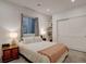 Cozy bedroom features a window, bookshelves, neutral walls, and carpeted floors at 11246 Bellsong Ln, Littleton, CO 80125