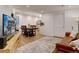 Open living space featuring hardwood floors, recessed lighting, and neutral paint at 11246 Bellsong Ln, Littleton, CO 80125