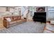 Inviting living room featuring a leather sofa, piano, and a seamless flow to the kitchen and dining areas at 11246 Bellsong Ln, Littleton, CO 80125