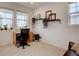 Bright home office featuring a desk, shelves, and large windows at 11246 Bellsong Ln, Littleton, CO 80125