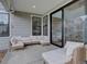 Covered patio with comfortable wicker furniture and outdoor decor at 11246 Bellsong Ln, Littleton, CO 80125