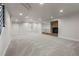 Open basement layout with fireplace, recessed lighting, and a large living space at 10 Summit Ash, Littleton, CO 80127