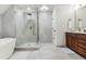 Beautiful bathroom featuring a glass shower with a bench and a double sink vanity at 10 Summit Ash, Littleton, CO 80127
