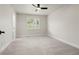 Clean bedroom with a ceiling fan and a window with views of the outside at 10 Summit Ash, Littleton, CO 80127