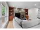 Inviting living room with a fireplace, stylish built-ins, and lots of natural light at 10 Summit Ash, Littleton, CO 80127