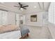Spacious main bedroom with a ceiling fan, and an ensuite bathroom and walk-in closet at 10 Summit Ash, Littleton, CO 80127