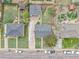A top-down perspective of neighborhood houses displaying various architectural styles and green lawns at 7001 Alan Dr, Denver, CO 80221