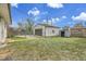 The backyard includes a detached garage, utility shed, and green lawn area at 7001 Alan Dr, Denver, CO 80221
