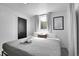 Simple bedroom with a comfortable bed, large window, and soft lighting, creating a restful ambiance at 7001 Alan Dr, Denver, CO 80221