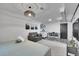 Open living space includes bed, sitting area, dining table, kitchenette, offering comfort and convenience at 7001 Alan Dr, Denver, CO 80221