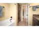 Bathroom with walk-in shower, soaking tub, and granite countertop on the vanity at 3450 E Easter Ave, Centennial, CO 80122