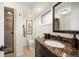 Modern bathroom with a granite countertop, sleek fixtures, and walk-in shower at 3450 E Easter Ave, Centennial, CO 80122