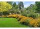 Beautiful landscaping showcases flower beds with colorful yellow flowers and greenery at 3450 E Easter Ave, Centennial, CO 80122