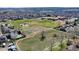 Aerial view of neighborhood featuring a park with baseball fields and other recreation facilities at 325 Mulberry Cir, Broomfield, CO 80020