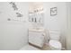 A well-lit bathroom featuring a white vanity, matching fixtures, and decorative wall accents at 325 Mulberry Cir, Broomfield, CO 80020