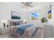 This bedroom features a light color scheme, a large window, and a ceiling fan at 325 Mulberry Cir, Broomfield, CO 80020