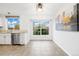 Bright dining area with white walls, tile flooring, and ample natural light at 325 Mulberry Cir, Broomfield, CO 80020